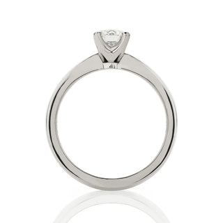 Side view of four claw solitaire engagement ring. Rex style setting with up-swept band.