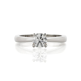 Four claw solitaire ring with a tapering band, made in platinum, with a 0.65ct round centre diamond. Top view.