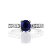 Solitaire ring with a cushion cut Ceylonese sapphire, and micro-claw diamond shoulders. Made in Platinum.
